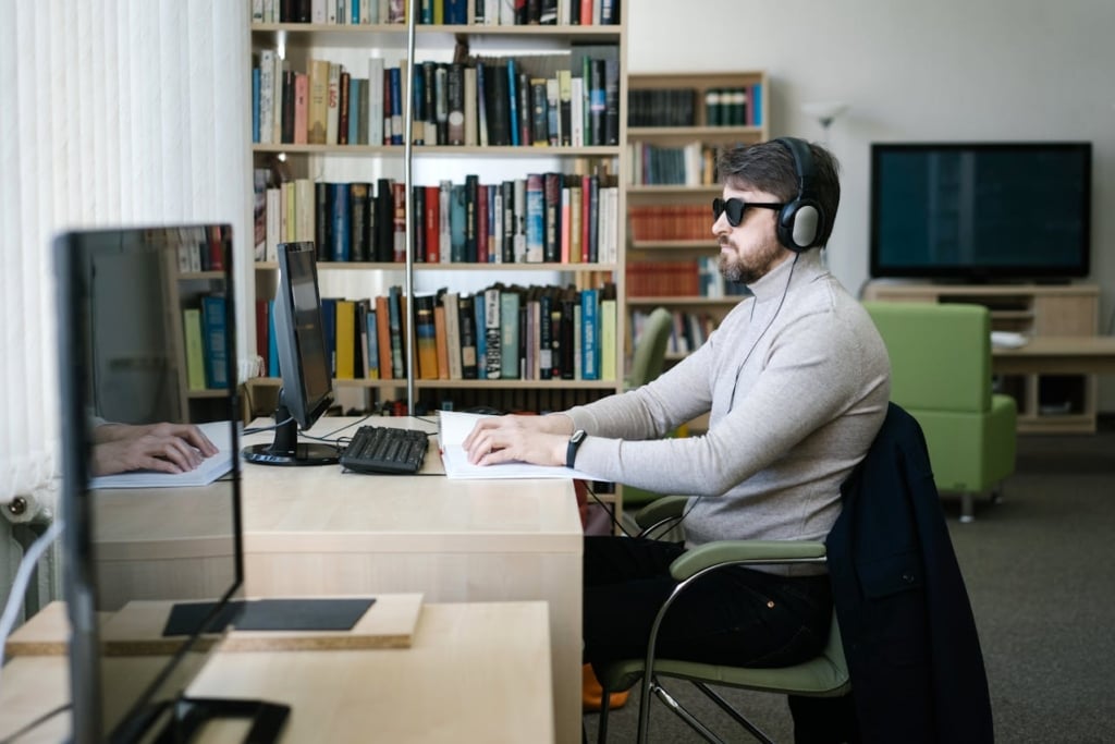 Man with vision impairment using a computer