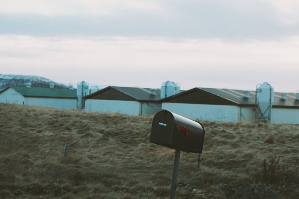 Old mailbox in a rural town, leaning over slightly.