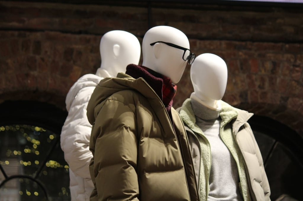 Mannequins in different clothes on a dark background